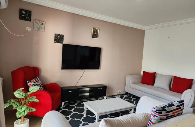 Duplex bien equipe securise avec jardin et veranda