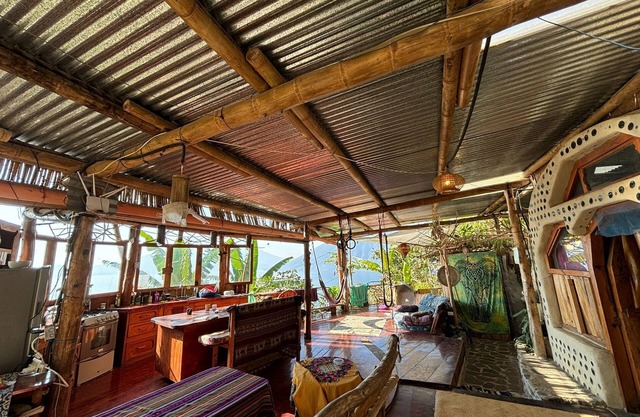 Earthship 3-level apt., portside, connected to an outdoor kitchen with a view.