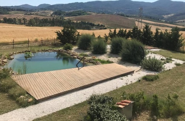 Ecological villa with bio-pool immersed in the Tuscan countryside