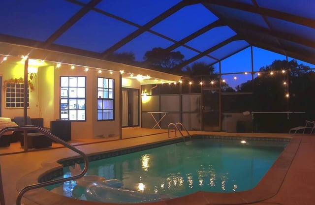 Private heated pool for relaxing and an outdoor kitchen for making barbecue .
