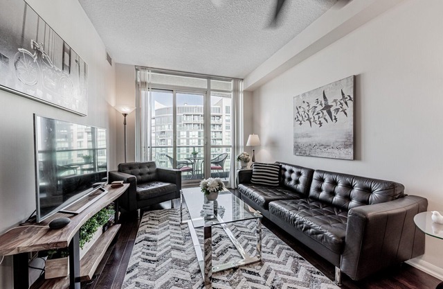 Elegant Downtown Oasis with City and Lake Views Plus Parking!