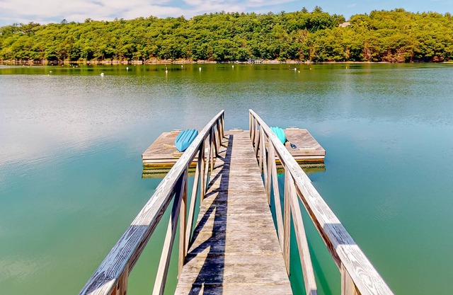 Elegant waterfront home with deep-water dock, gorgeous view & lovely deck