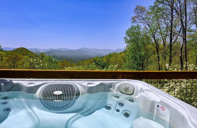 Enchanting dog-friendly alpine escape with hot tub, fireplace, deck, W/D & views