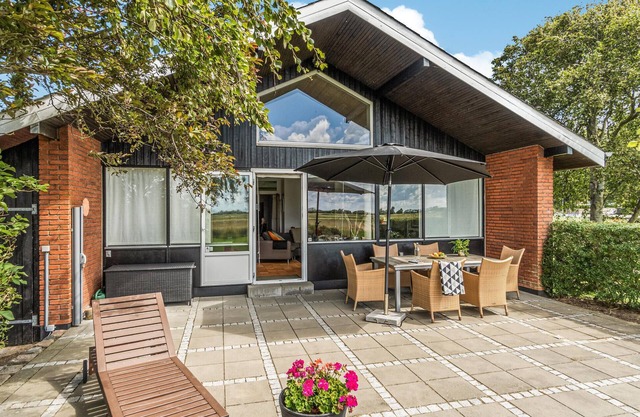 Enjoy a great view of the countryside from the terrace of this vacation home.