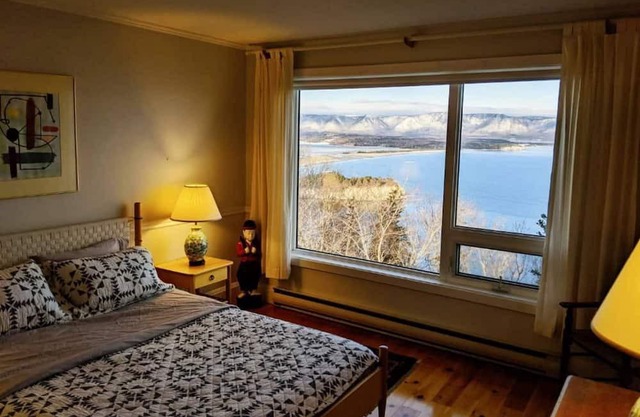Enjoy the stunning views of the Cape Breton Highlands atop this cliffside estate