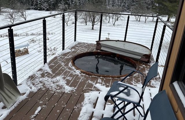 Enjoy whatever winter throws at you while you relax in the hot tub with a view!