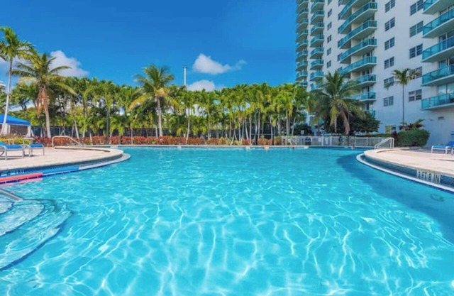 Entire condominium with a pool view, steps from the beach