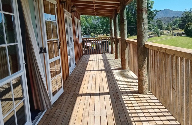 The house by the water. Tidal river, children play you watch from the balcony.