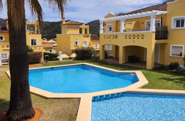 Escape to the heart of a golf course: House with sea and mountain views