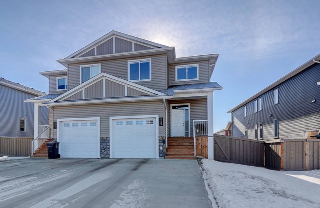 Executive style 4-plex unit is located in Whispering Ridge.