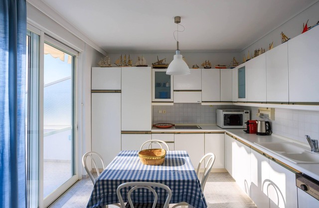 Exquisite Villa in Athens Suburbs, Steps from the Beach, Hosting a Private Pool