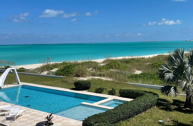 Family estate coach house and guest house on TC beach with beautiful pool