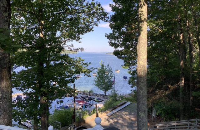 Family Friendly house with lakefront views surrounded by trees