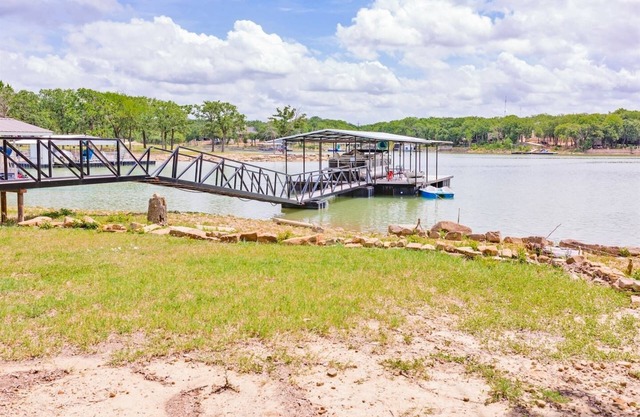 Family lake front home with dock, kayak, outdoor kitchen and more