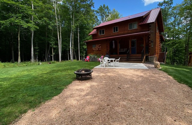 Family log home nestled in the woods just minutes from trails.