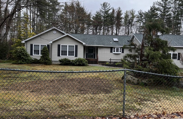 Family orientated one floor ranch style home with two car garage and Lake Access