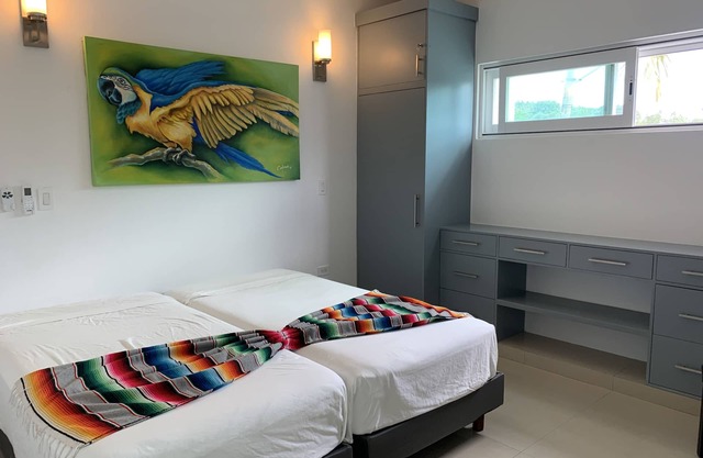 Family-sized private home walking distance to airport! 2 min (car) to the ocean.