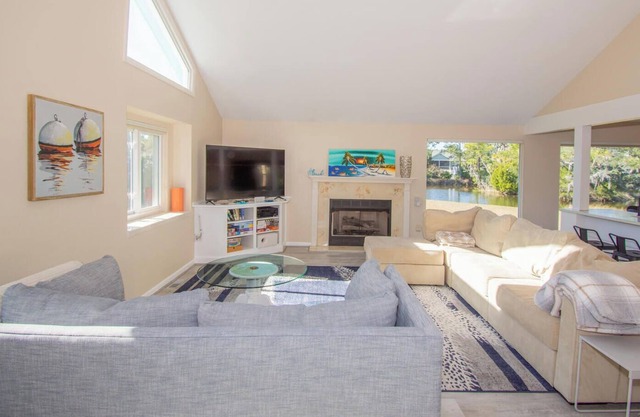 Fenced backyard w/ pond, fire pit, screened porch, ping pong, Golf cart incl.