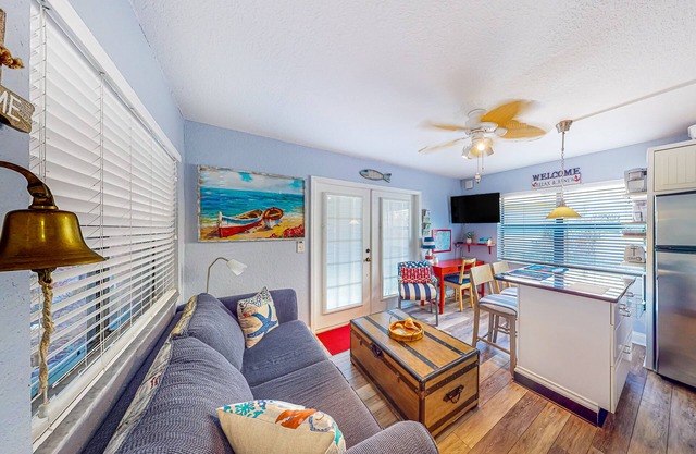 First-floor condo with courtyard-style pool, grills, & easy beach access