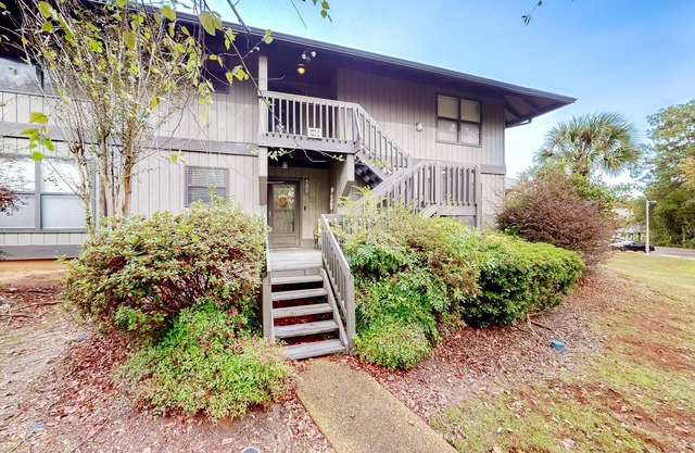 First-floor updated condo with pool, tennis court, balcony, & AC - dog-friendly