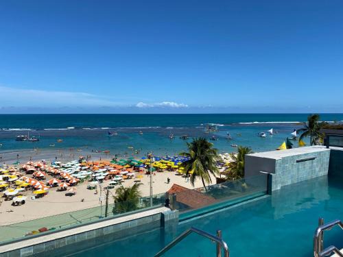 Flat beira mar com varanda em Porto de Galinhas