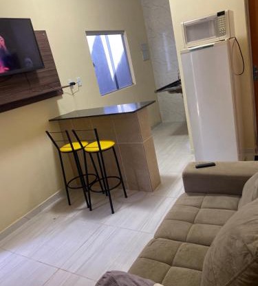 Flats com ar condicionado, garagem e internet