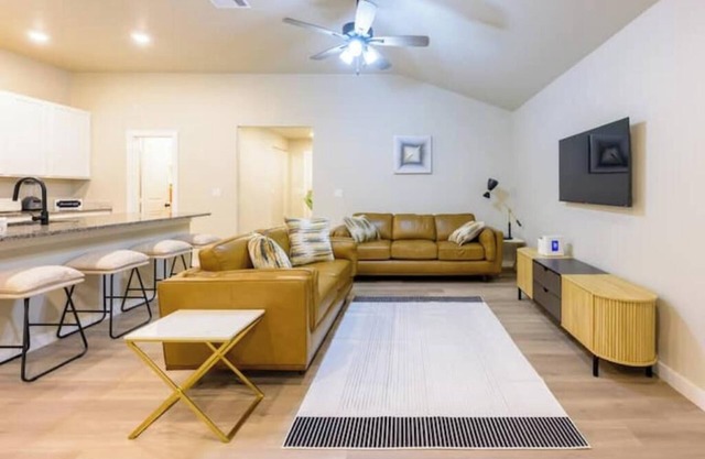 Four bedroom with 1 king bed and 3 queen beds each with a TV. Centrally located!