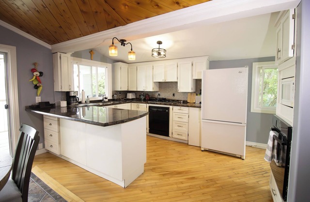 Four Season Serene Lake House with Stunning Lake Views, Private Dock and Sauna.