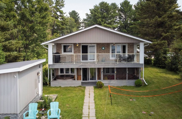 Four Season Serene Lake House with Stunning Lake Views, Private Dock and Sauna.