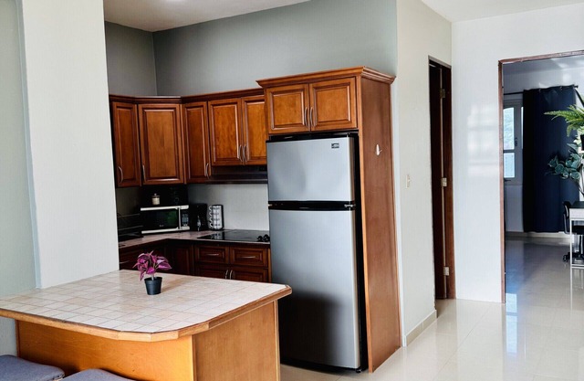 Full apartment w/Kitchen, A/C, WIFI and 1 min to the Beach