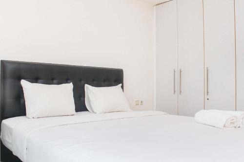 Fully Furnished with Cozy Design 2BR The Bellezza Apartment By Travelio