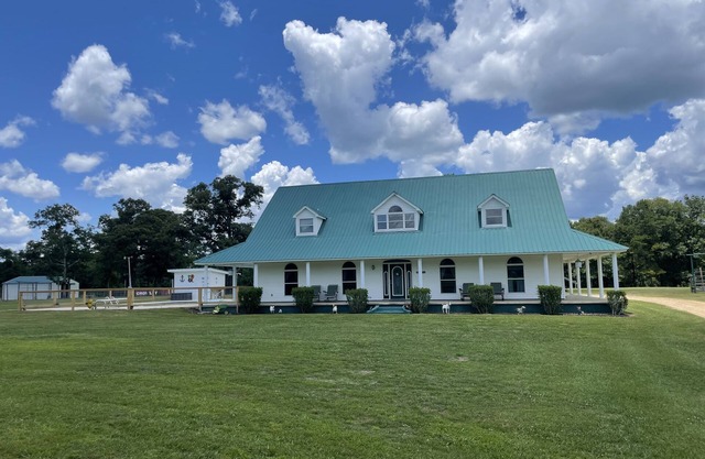 Gated Farmhouse on 93 acres pool & access to red creek from property.