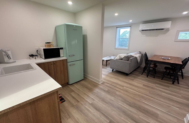 Golden Acre Suites | 2BR Downtown w/ Exposed Brick & Retro Retreat