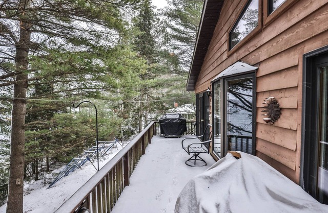 Gorgeous 5 bedroom home on Two Sisters Lake with direct snowmobile access!
