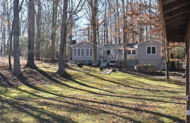 Great! 4 bedroom/3 full baths with fire pit patio overlooking the lake