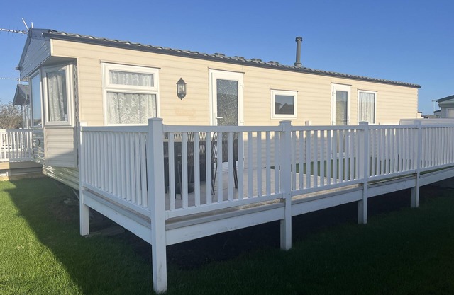 Great 8 berth caravan with decking area, near to Caister beach ref 65054EB