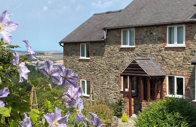 HERON COTTAGE, pet friendly, with open fire in Hope, Shropshire