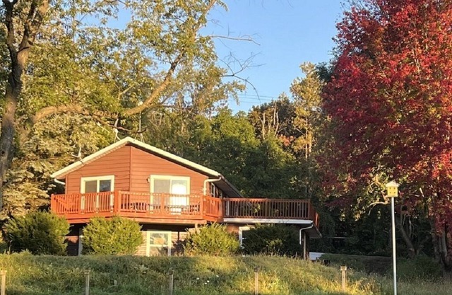 Hilltop house overlooking Whitewater Lake with beach & boat access mins away.
