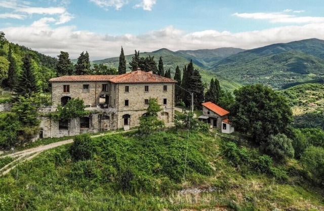 historic Tuscan farmhouse surrounded by nature