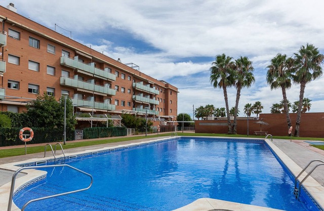 Holiday Apartment 'Les Gavines' with Sea View, Pool & Private Terrace