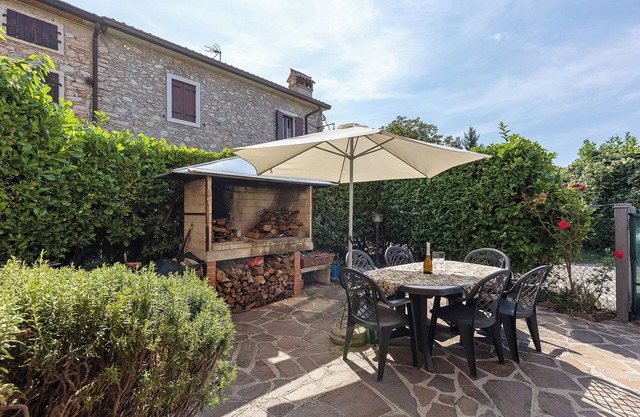 Casa de vacaciones 'Villetta Singola' con vistas al lago, terraza privada y Wi-Fi