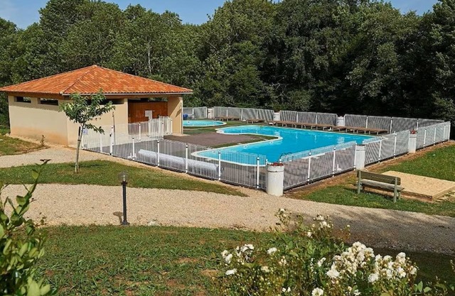 Holiday home in a park with a pool on the lot