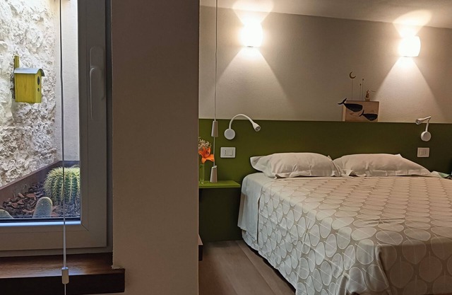 Casa de vacaciones 'Il Giardinetto' con terraza privada, Wi-Fi y aire acondicionado