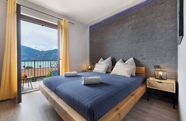 Casa de vacaciones 'Casa Di Tino' con vistas al lago, Wi-Fi y aire acondicionado