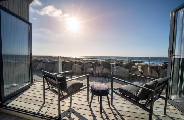 Holiday home 'Lista Maritim 1', built 2020, directly by the sea in Borhaug-Borshavn near Farsund on the Listafjorden, southern Norway, 6+3 persons, panoramic windows and terrace with spectacular sea views, modern furnishings, open plan living, 5 b.