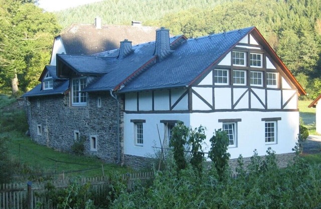 Holiday home old mill with wooden mill wheel