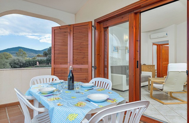 Casa de vacaciones 'Trilocale Con Vista Tavolara' con vistas a la montaña y aire acondicionado