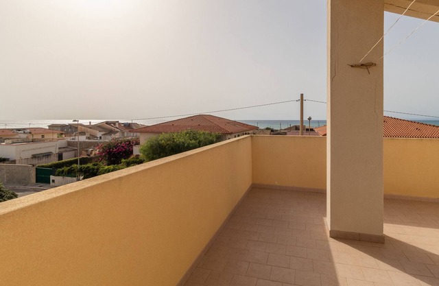 Casa de vacaciones 'Villetta Punta Braccetto' con vistas al mar, terraza y aire acondicionado