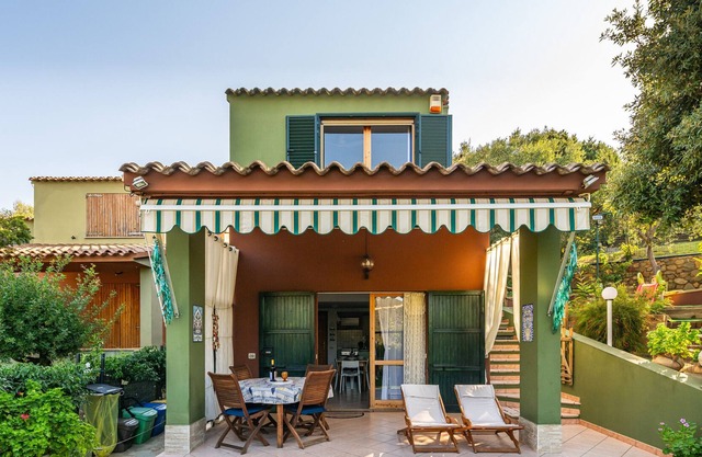 Casa de vacaciones "Villetta Anna a Porto Sa Ruxi" con vistas al mar, piscina compartida y Wi-Fi