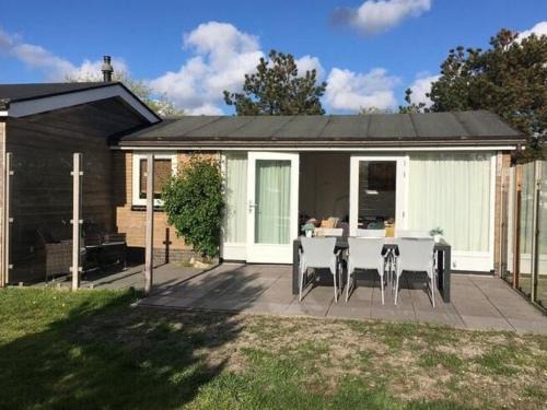 Holiday home with private garden by the sea